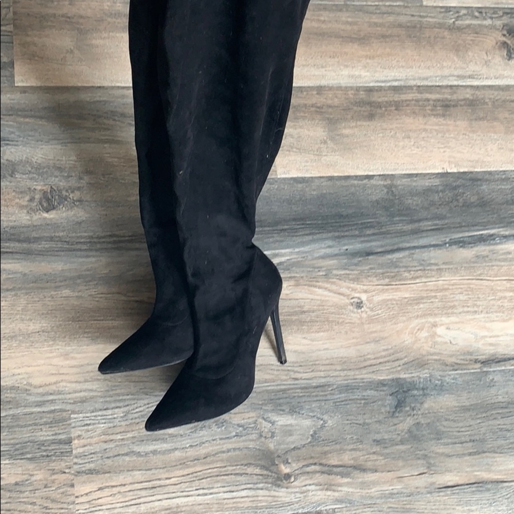 Thigh high heeled boots